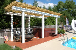 Pergola with hot tub by pool